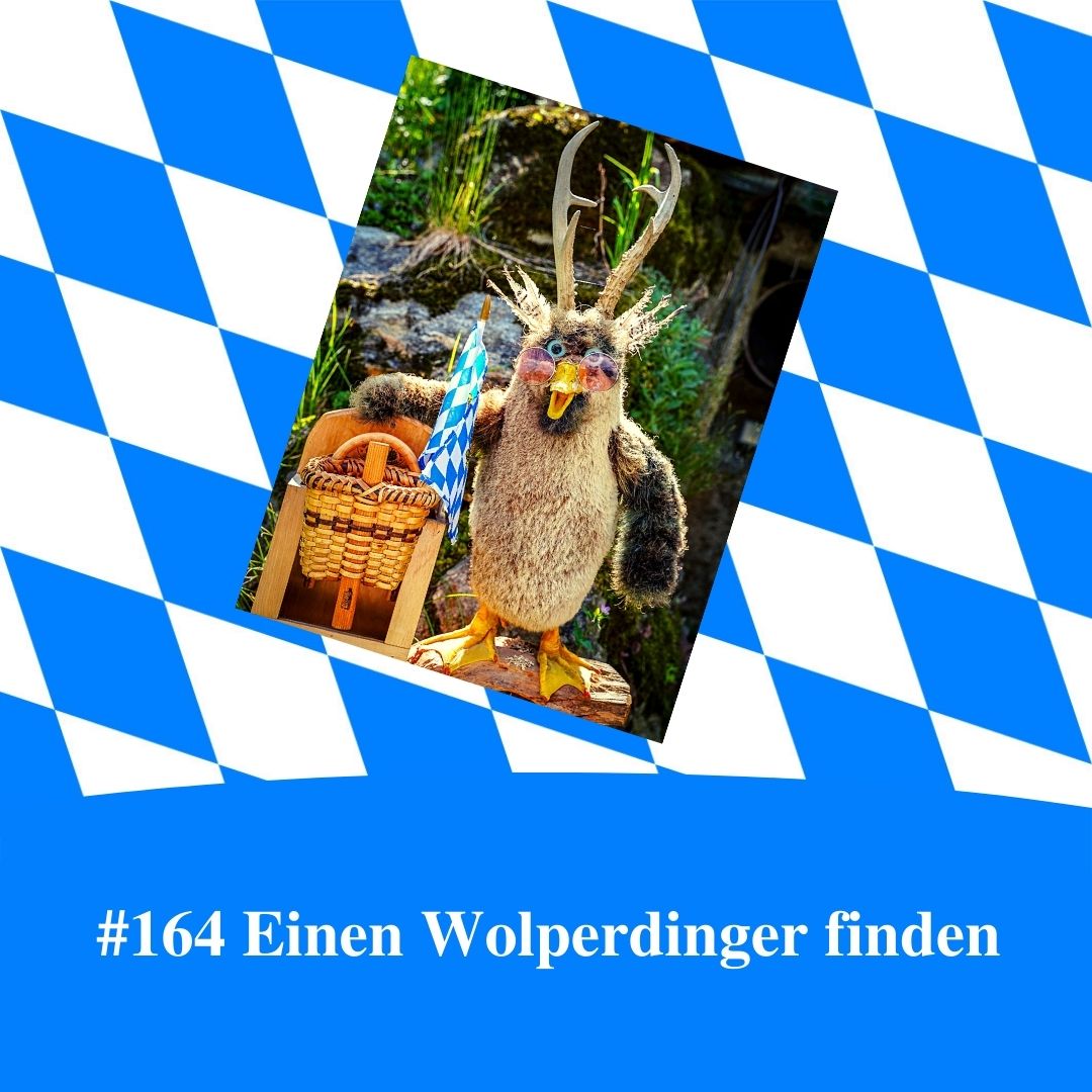 Bild für Folge Nummer 164 des bairischen Podcasts Bayern Absolut. Ein Wolperdinger weht mit einer bayerischen Flagge. Das Bild ist umrahmt von weiß-blauen bayerischen Rauten.